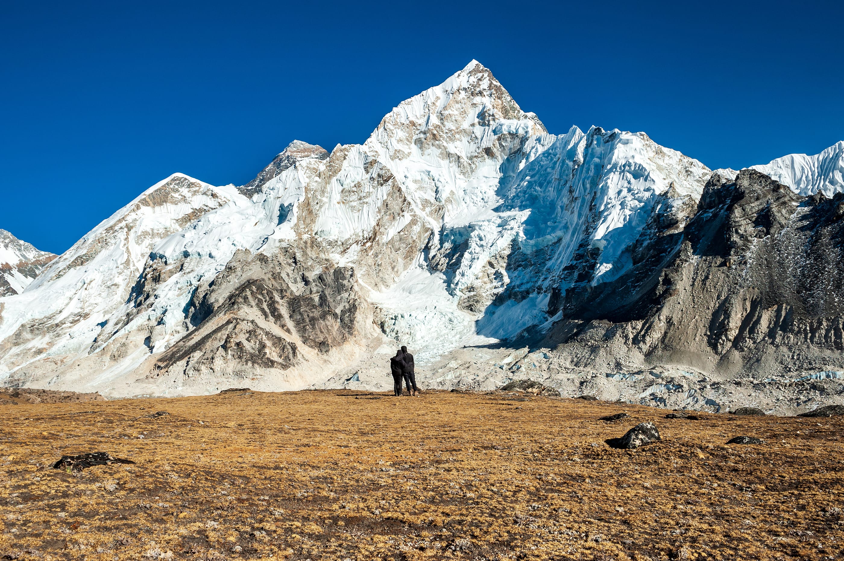 Young Couple Watching At Mount Mt. Everest And Nuptse Peak At Ka